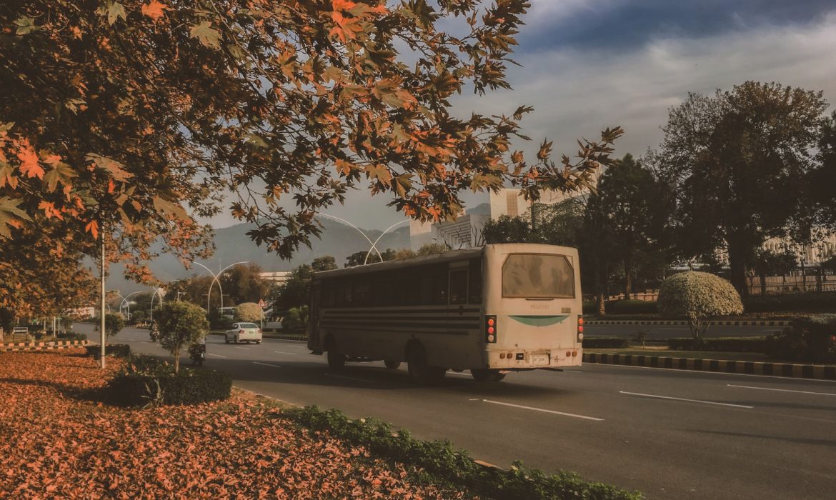 Best SEO Service Provider in Islamabad: white and yellow bus on road during daytime